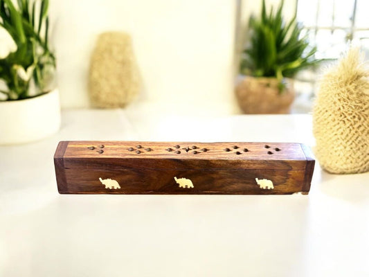 Wooden incense holder with brass elephant detailing